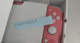 New
													Nintendo Switch Lite - Coral, photo 2 of 2