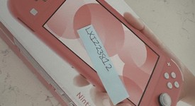New
													Nintendo Switch Lite - Coral, photo 1 of 2
