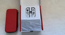 Mint
													Nintendo Switch - OLED - White, 64 GB, photo 3 of 12