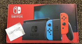 New
													Nintendo Switch - Red & Blue, 32 GB, photo 1 of 4