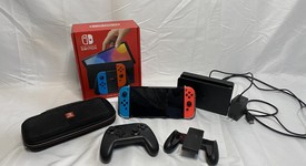 Good
													Nintendo Switch - OLED - Red & Blue, 64 GB, photo 1 of 9