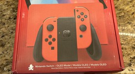 New
													Nintendo Switch - OLED - Red & Blue, 64 GB, photo 2 of 3