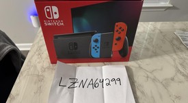 New
													Nintendo Switch - Red & Blue, 32 GB, photo 1 of 3
